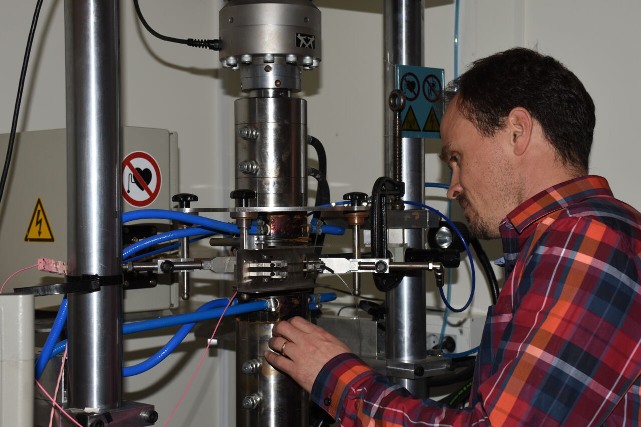A man working with a microscope. 