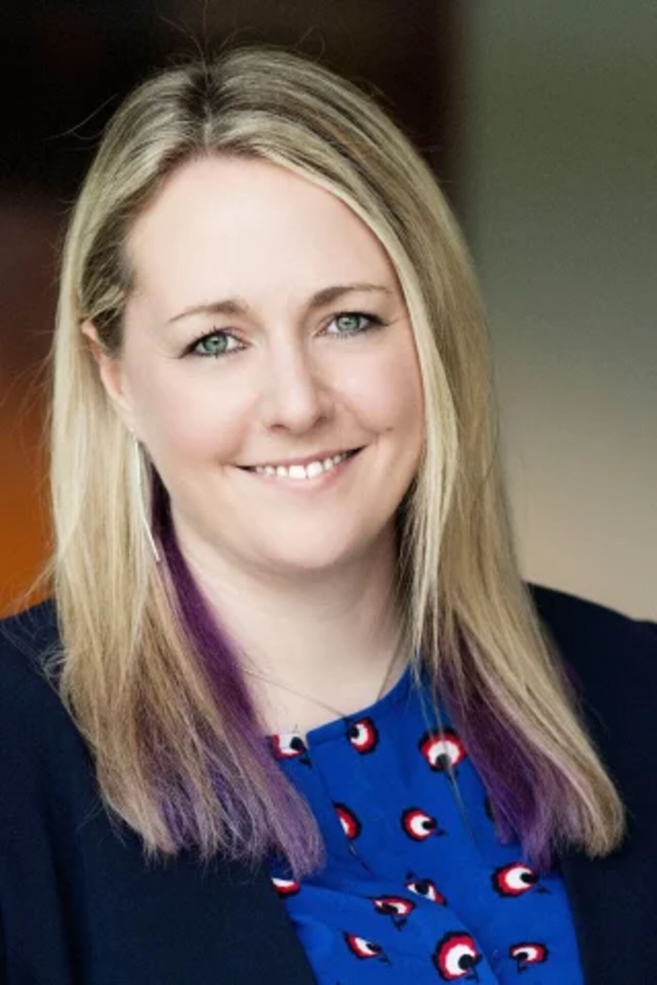 portrait of person in front of a white background.