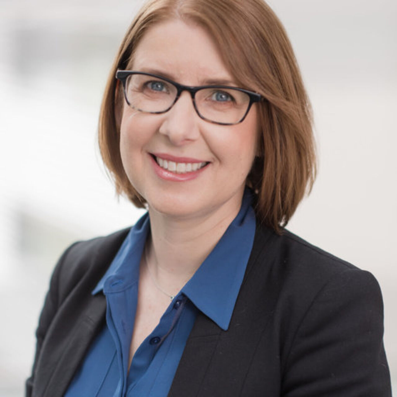 portrait image of a person in front of a white background.