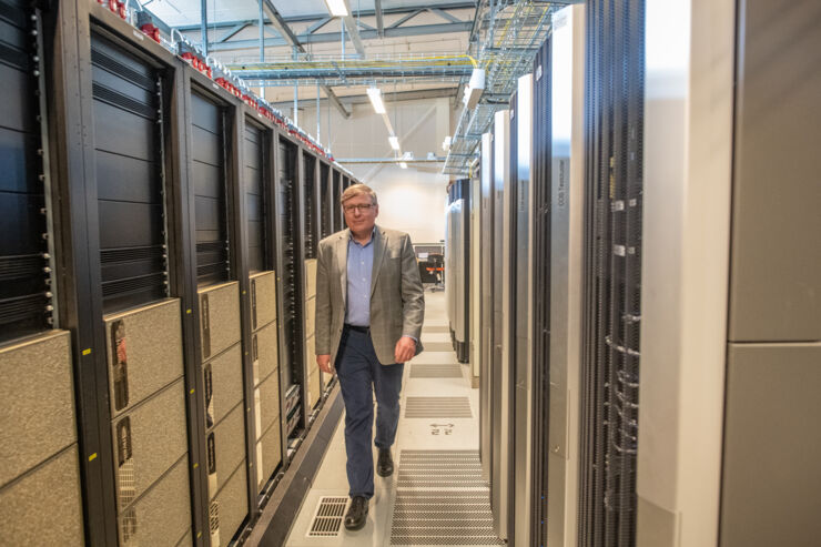 Igor Abrikosov walks between two supercomputers. 