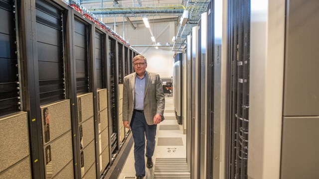 Igor Abrikosov walks between two supercomputers. 