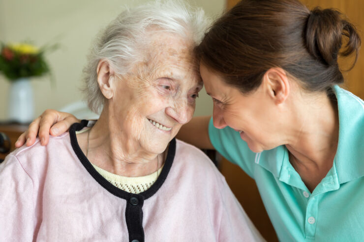 Old woman and health care personell