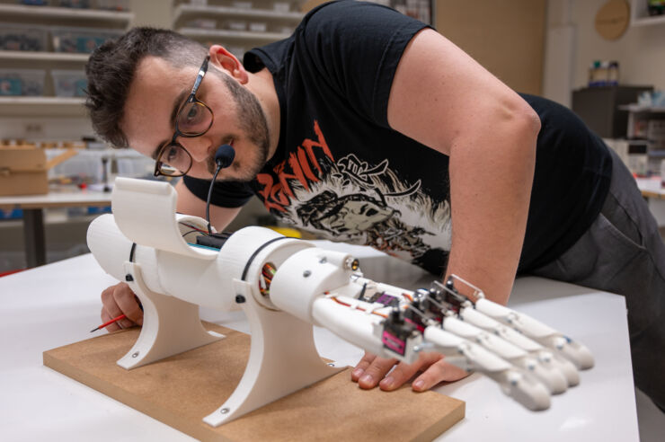 Pablo Montoyo Gomis testing voice-controlled prosthesis.