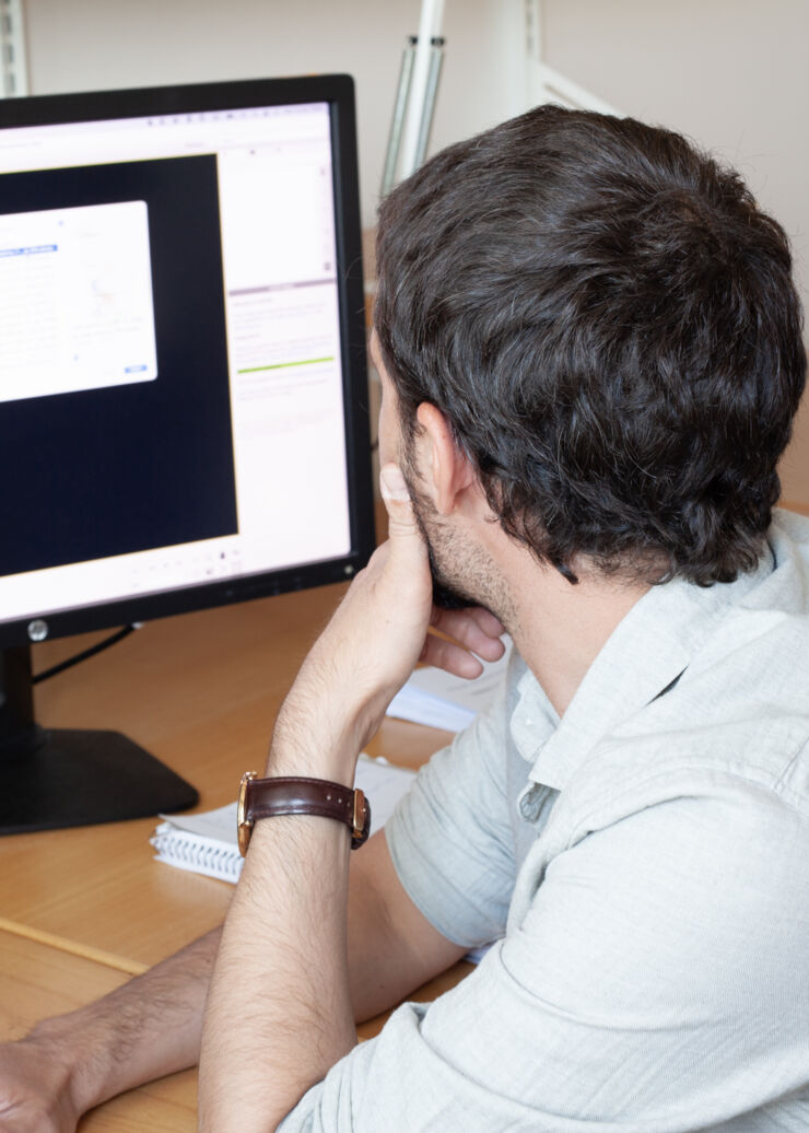 Davide Gambino in front of  computer