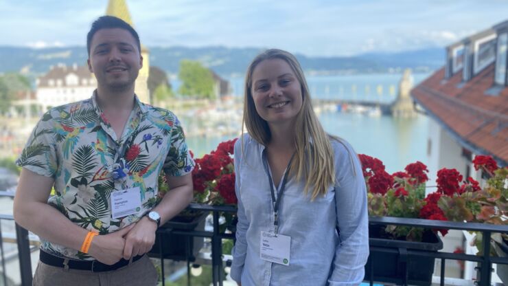 Two people standing on a balcony in Lindau.