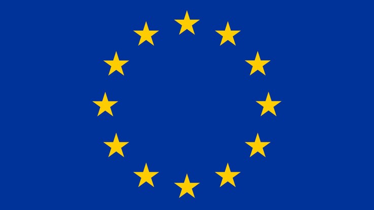 EU:s flagga, blå bakgrund med gula stjärnor.