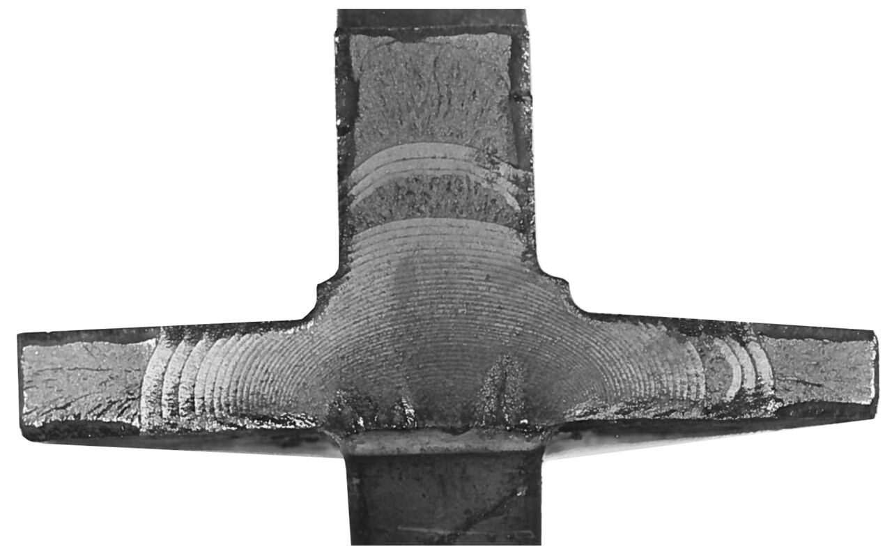 Fatigue testing result from a steel detail in a fighter jet (Viggen). Crack initiation at the bottom with intermittent crack front propagation and arrested states with an increasing speed (Paris' law).