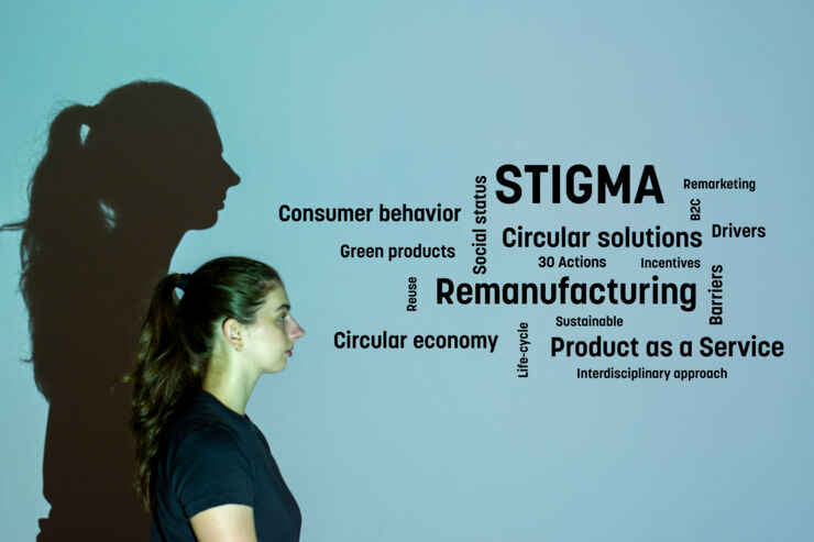 A woman looking at som keywords that is associatet with remanufacturing. These words are manufacturing, reuse, remarketing, circular economy, circular solutiosn product as a service, sustainable, consumer behavior.