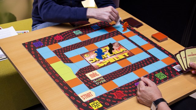 Two people playing a board game.