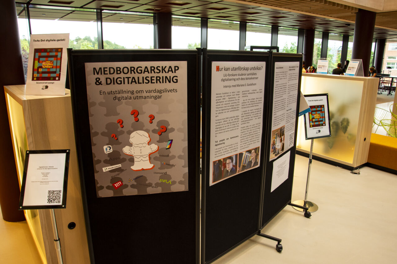 Posters and signs at an exhibition.
