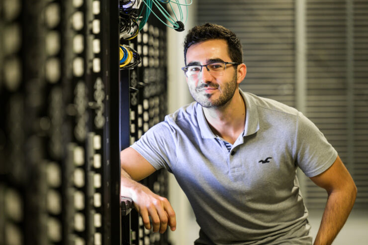 Young man in computer hall.