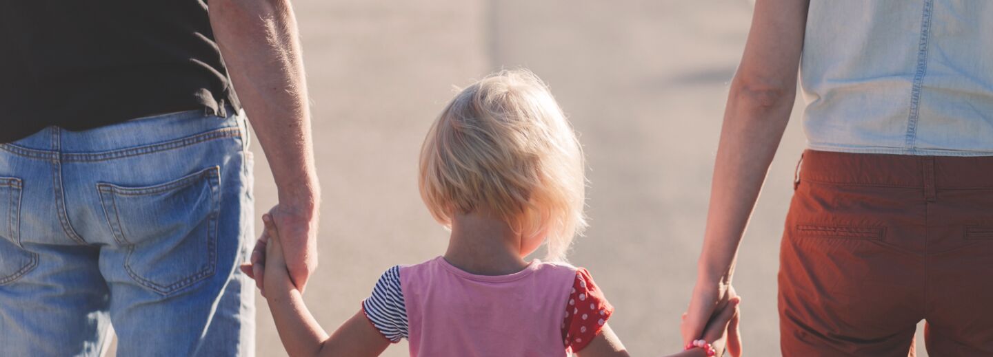 Family holding hands.