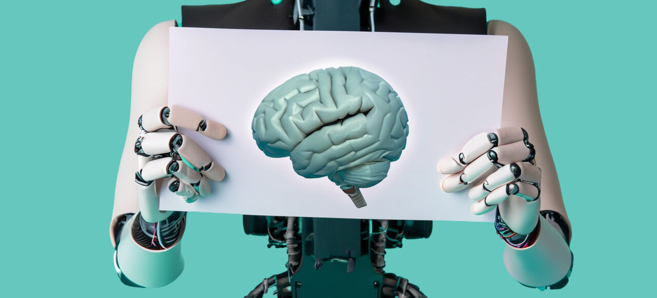 Robot shows a paper with an image of a brain