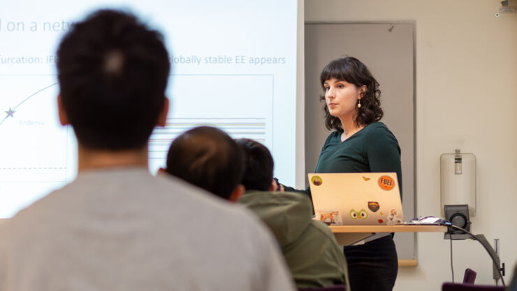 Anastasia Bizyaeva, postdoc, conducting a seminar.