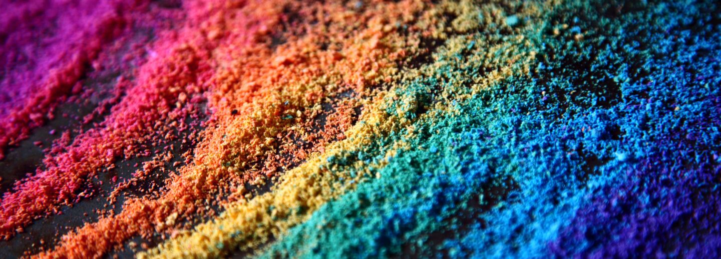 Grains of sand in the colors of the rainbow