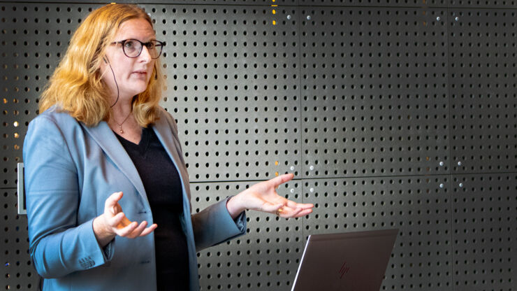 Female scientist lecturing.