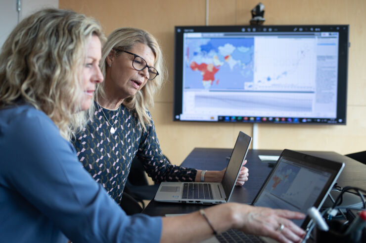 Two women at at computer.