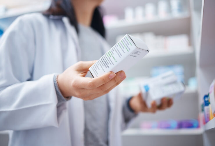 Woman holding medicines.