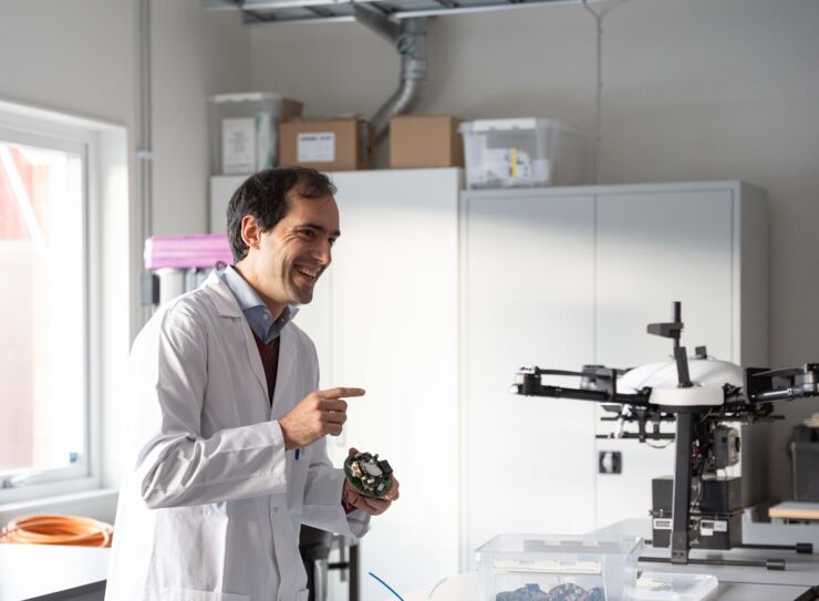 A man in a white lab coat.