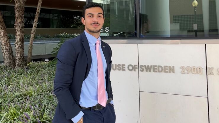 Portrait of a man in front of a building