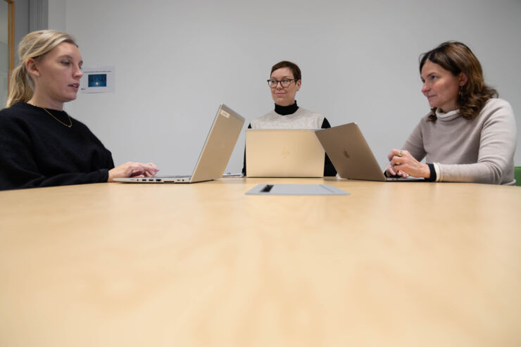 Three women having a meeting.