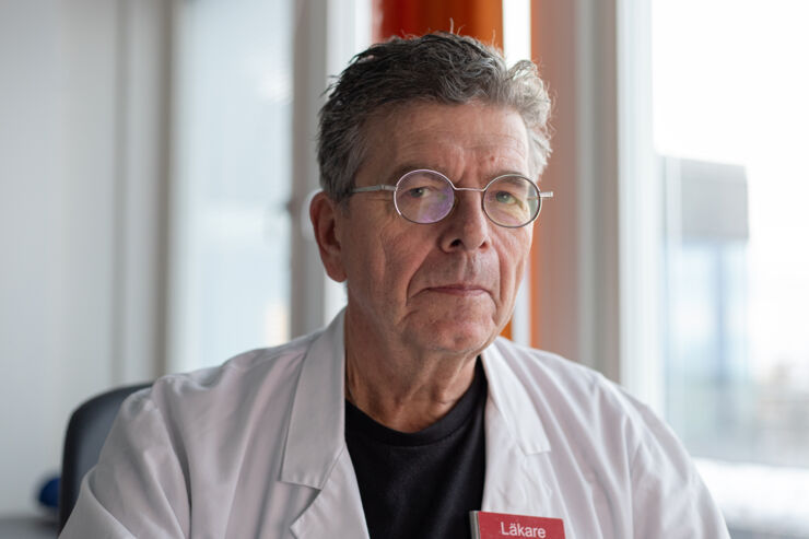 headshot of older male physician.