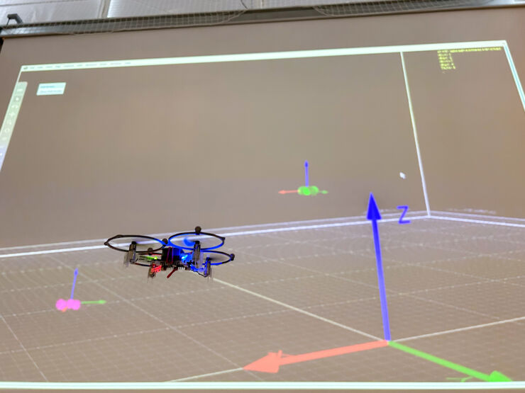 Drone in front of a positioning system 3D model.
