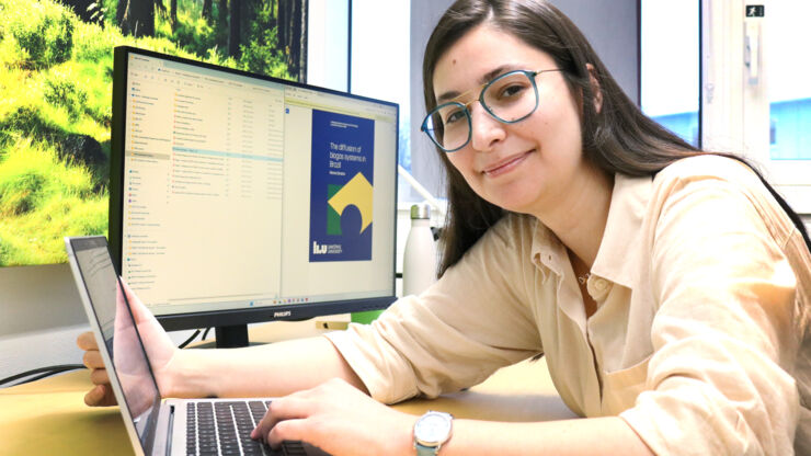 Photo of PhD-student at her office.