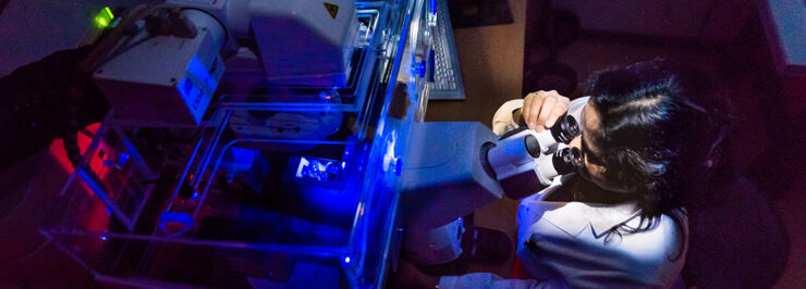 Researcher in a dark room. A header image for WCMM.