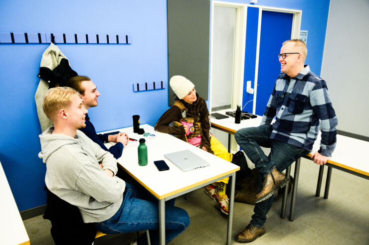 A teacher and students having a conversation