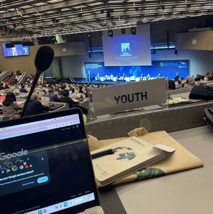 Conference chamber with sign in the foreground with the word Youth on it.