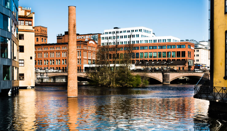 Old industrial bildnings with water in the foreground