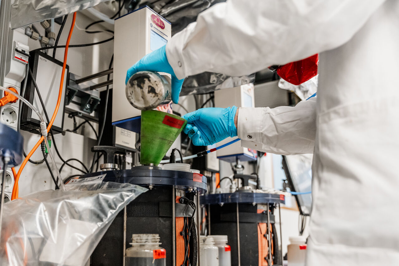 A biogas reactor is being fed in the environment research laboratory