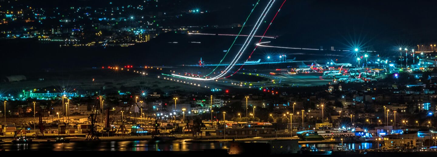 Harbour and airfield at night with lights shining