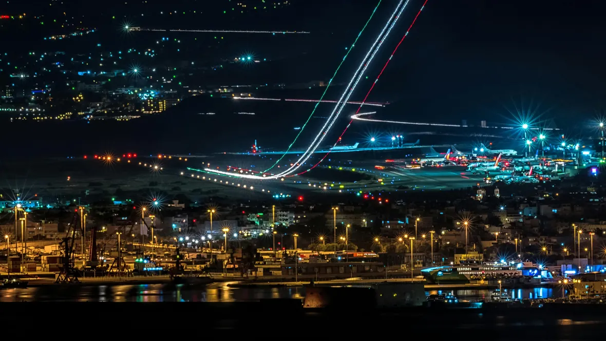 Harbour and airfield at night with lights shining