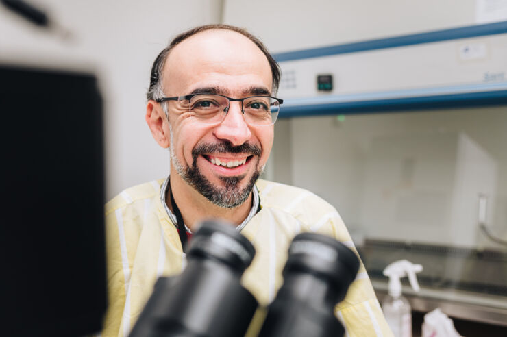 Headshot of a man in a clinical reserch lab.