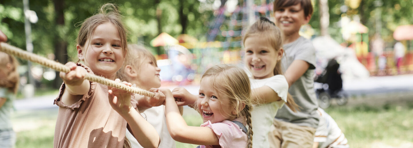 Children playing tug-of-war.