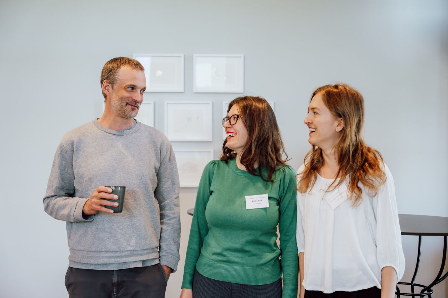 Three researchers looking at each other