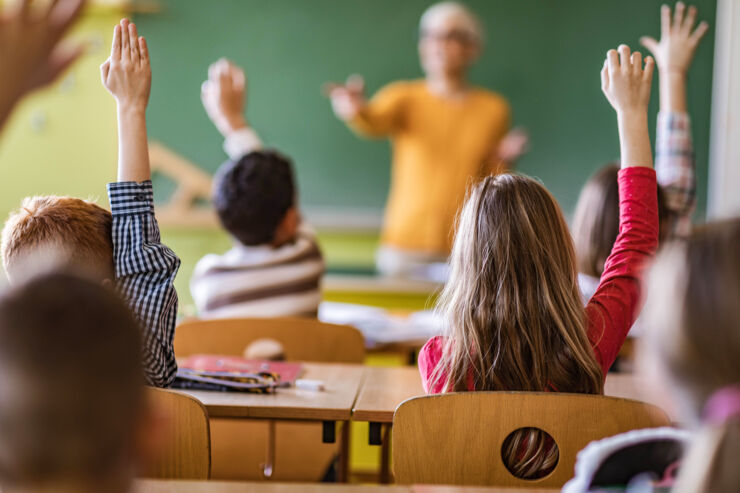 Students and teachers in a classroom.