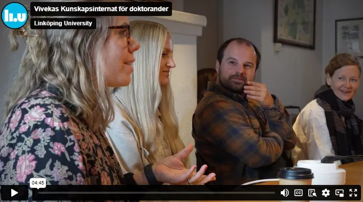 PhD students sitting at a table