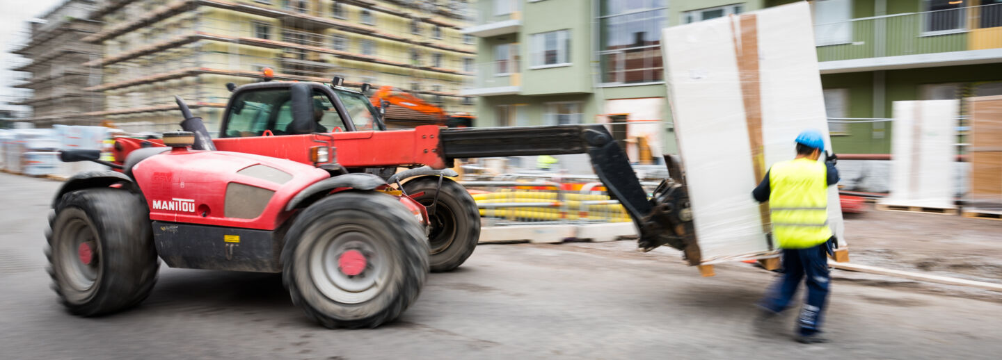 Construction worker and machine