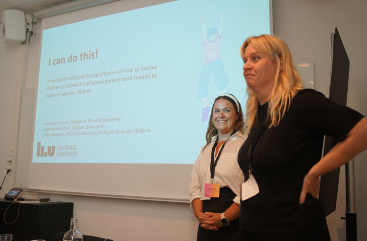 Two women at a lecture