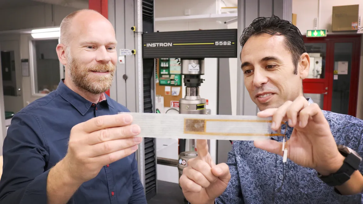 Two male scientists in lab.