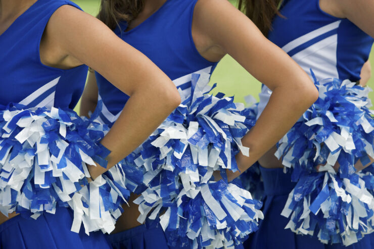 Cheerleaders in a row.