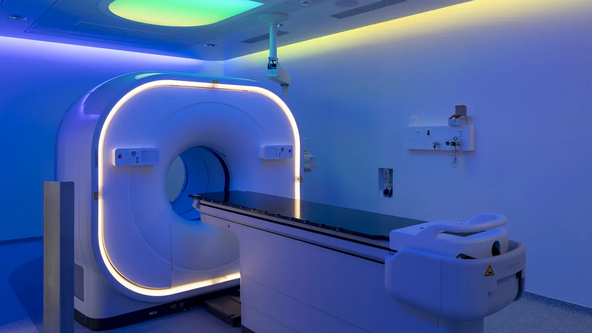 View of a scanner room bathed in blue light