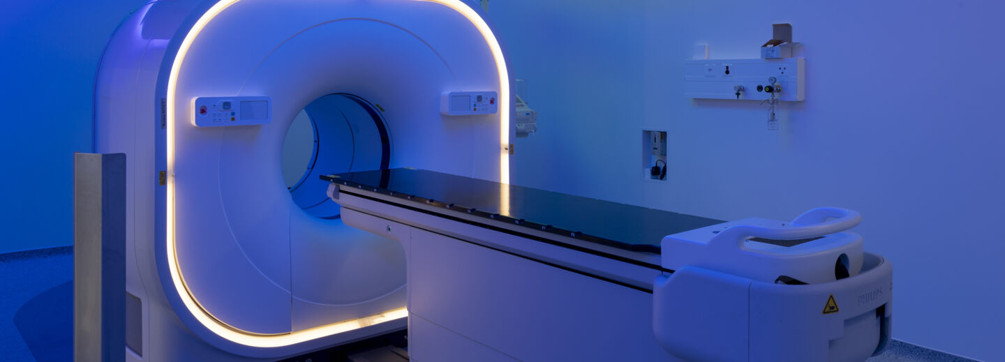 View of a scanner room bathed in blue light