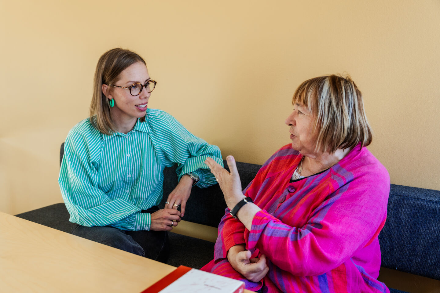 Two female researchers in conversation