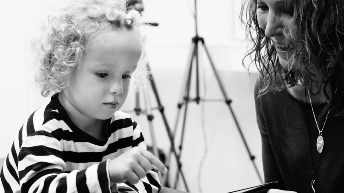 a young child is involved in a research project.