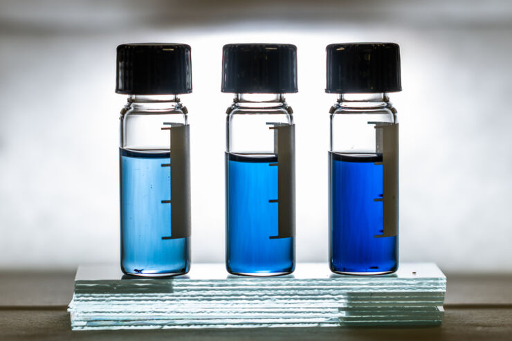 Three flasks containing blue fluid.