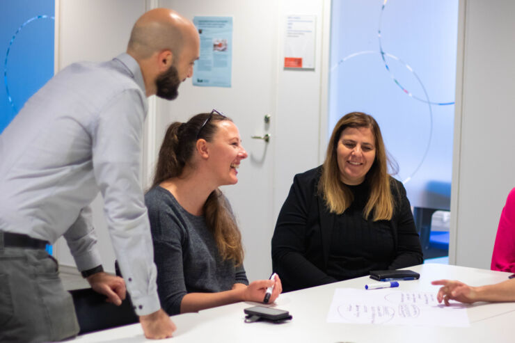 Thre phd students in a workshop.